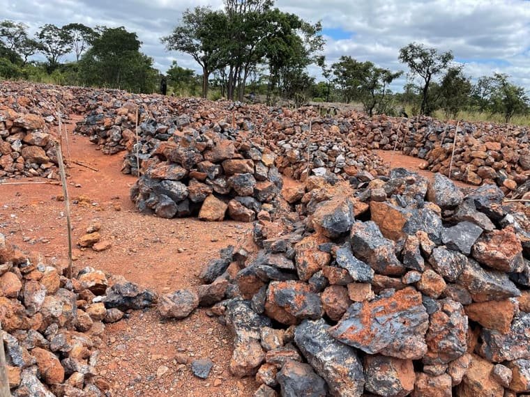 Crushed and sized manganese ore in graded stacks
